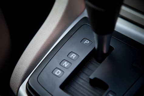 What is the gear shifter called in an automatic car, and why does it sometimes feel like a magic wand?